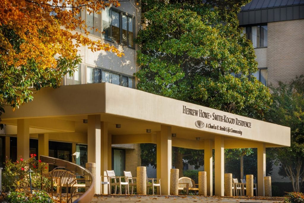Front entrance of Hebrew Home facility with seating area