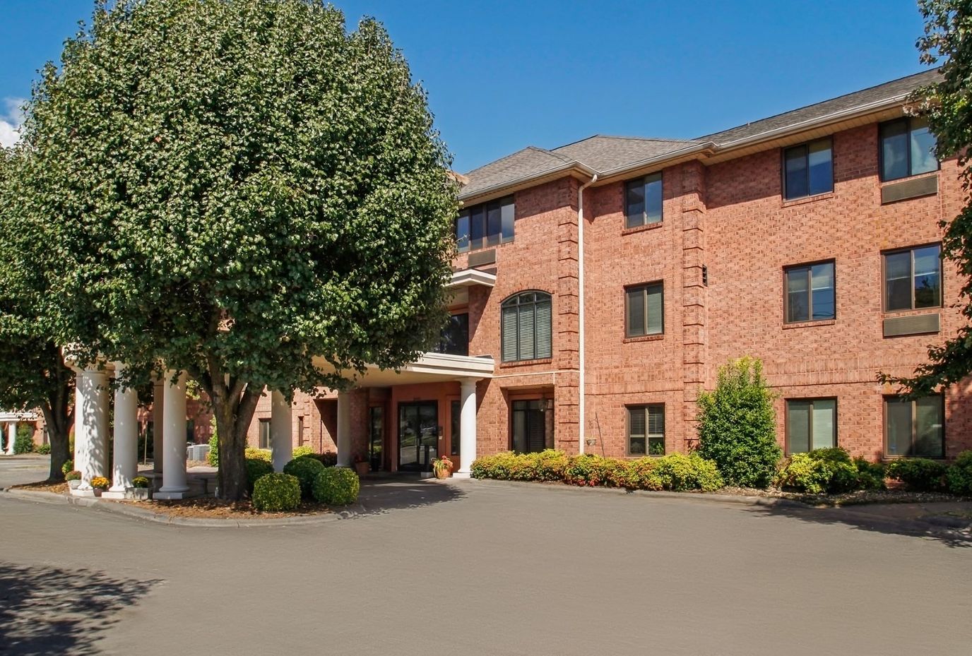Exterior view of a senior living facility entrance.