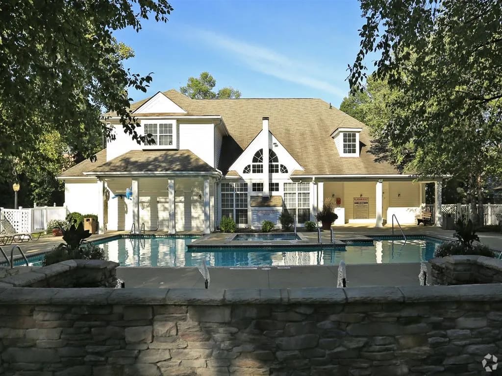 Exterior view of the facility's building and pool area
