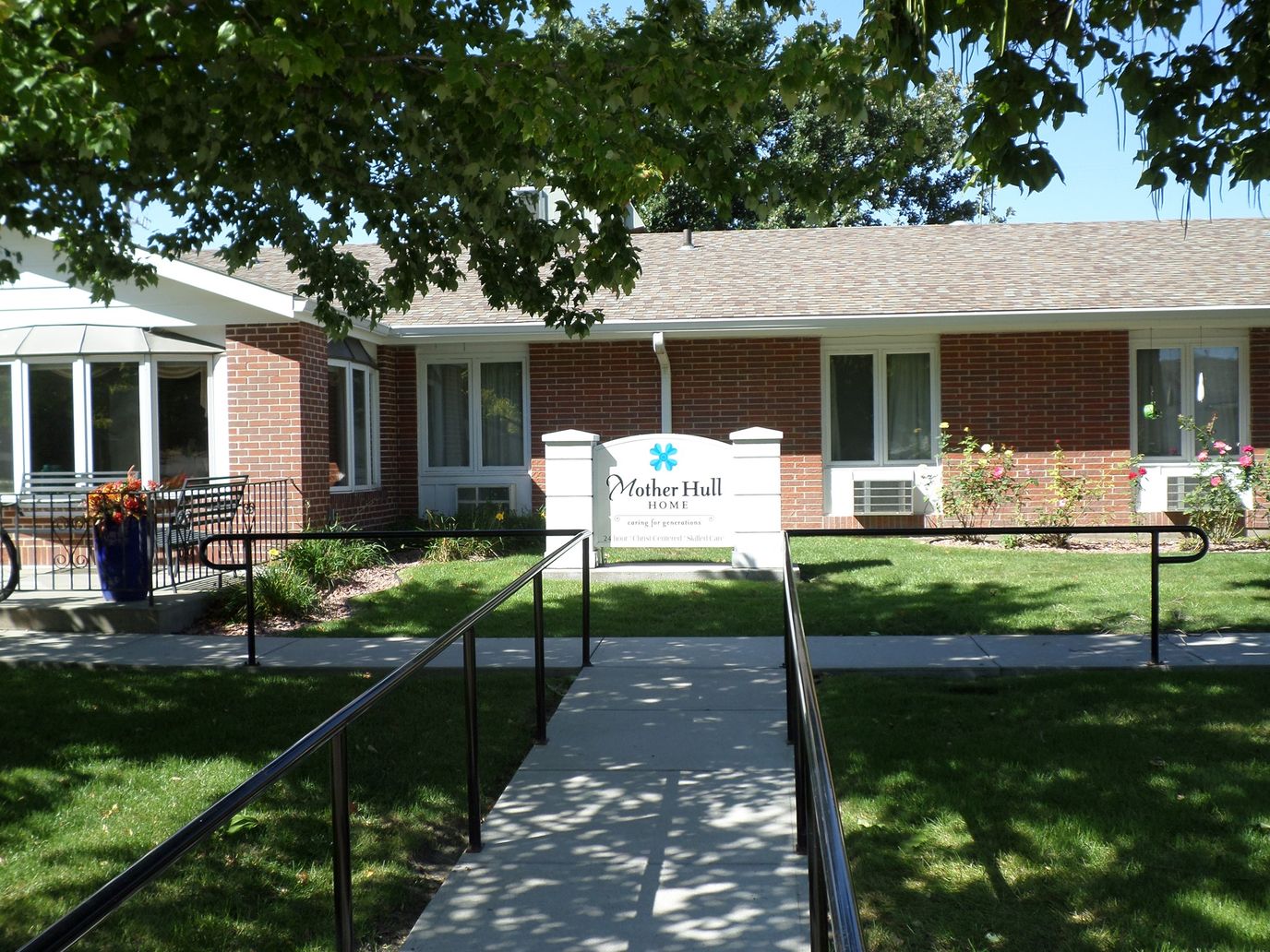 Exterior view of Mother Hull Home with landscaping