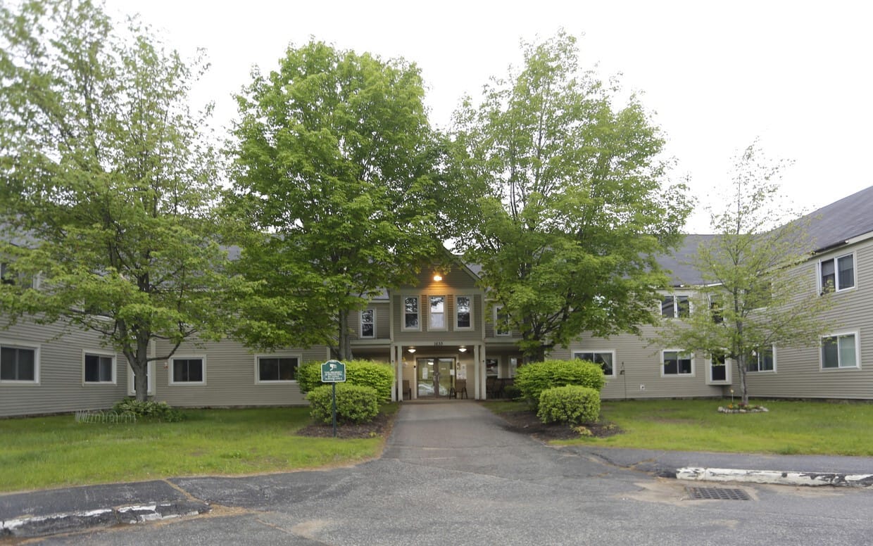 Front entrance of Oxford Meadow Apartments with greenery