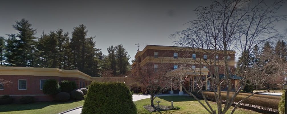 Exterior view of the assisted living facility with landscaping