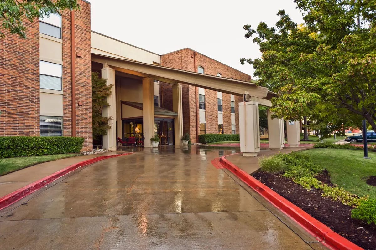 Entrance of Senior Star at Woodland Terrace with wet pavement