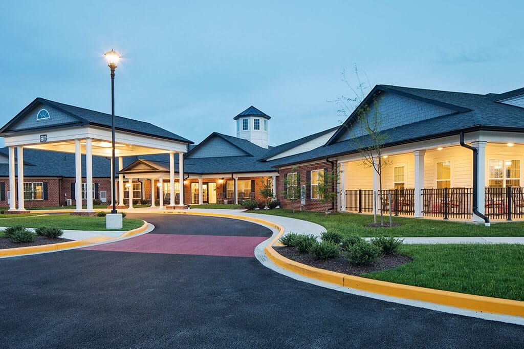 Exterior view of an assisted living facility at dusk