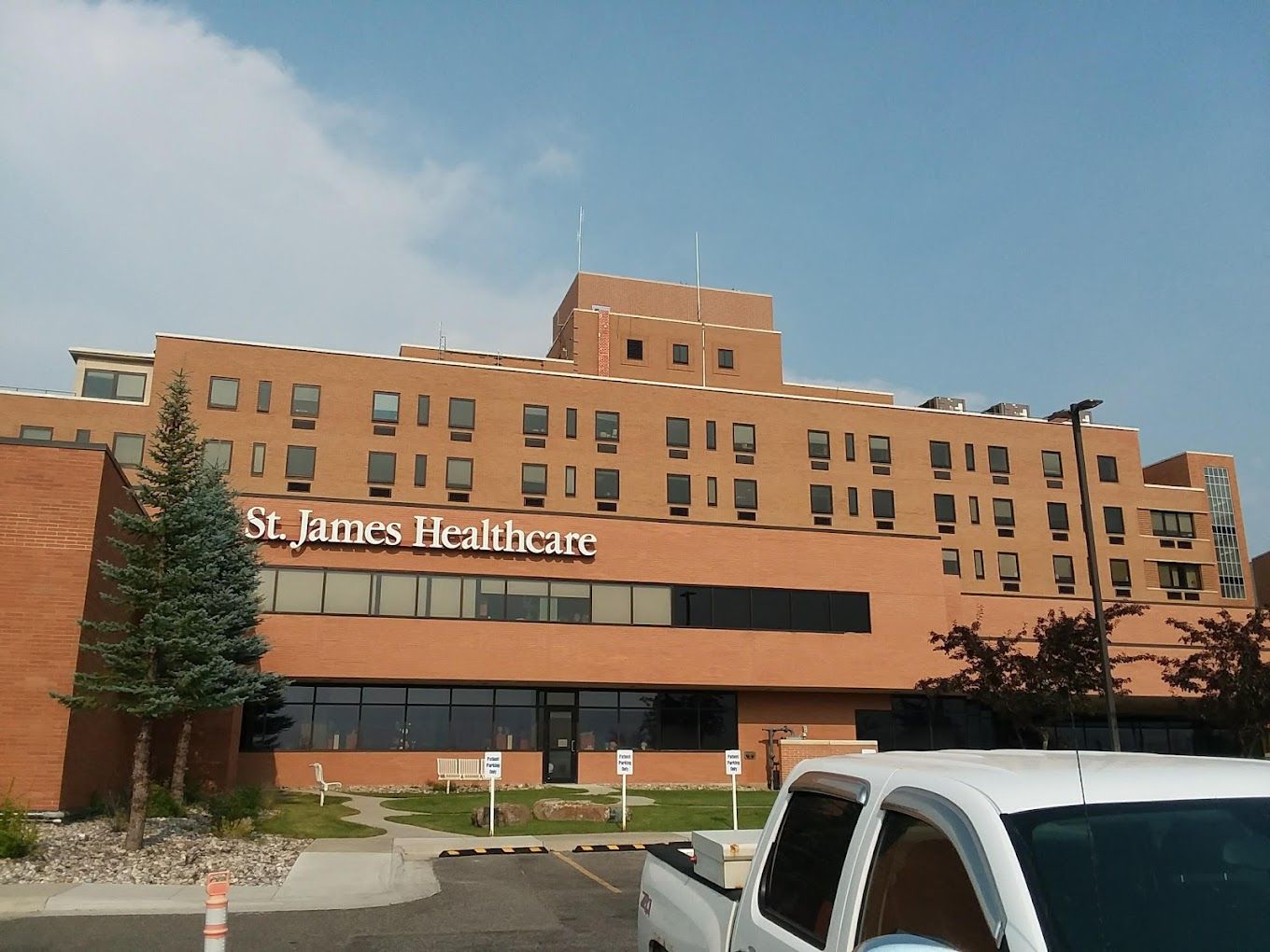 Exterior view of St. James Healthcare building with signage