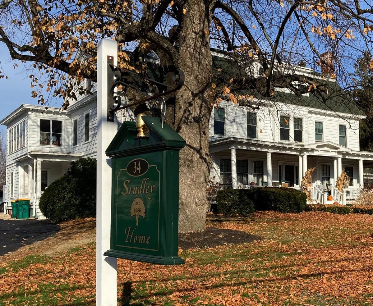 Exterior view of Studley Home with sign