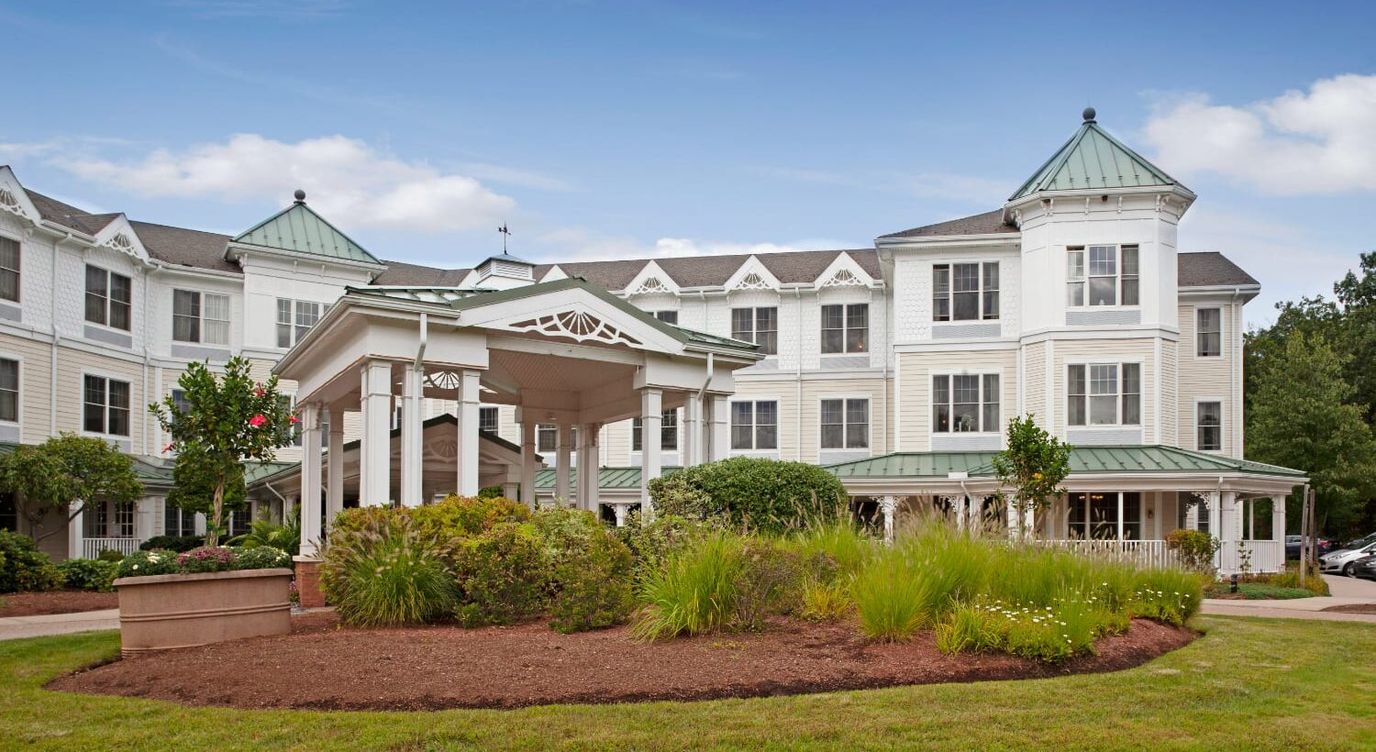 Exterior view of Sunrise of Burlington with landscaped garden