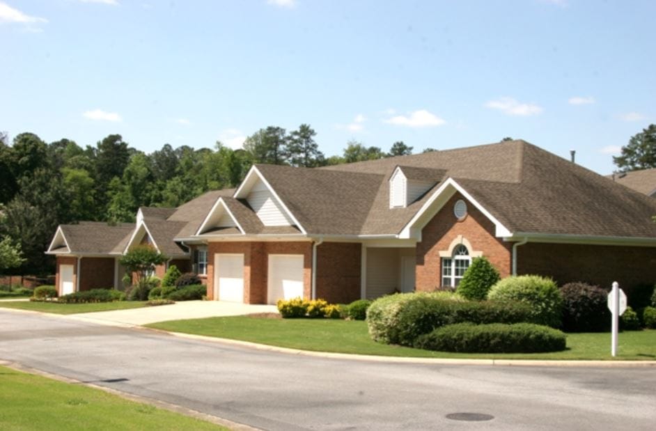 View of brick cottages with manicured landscaping