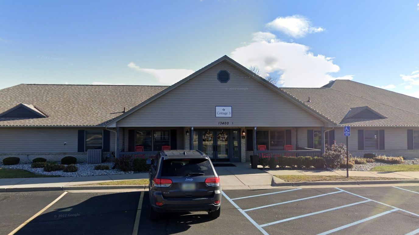 Exterior view of the assisted living facility with parking