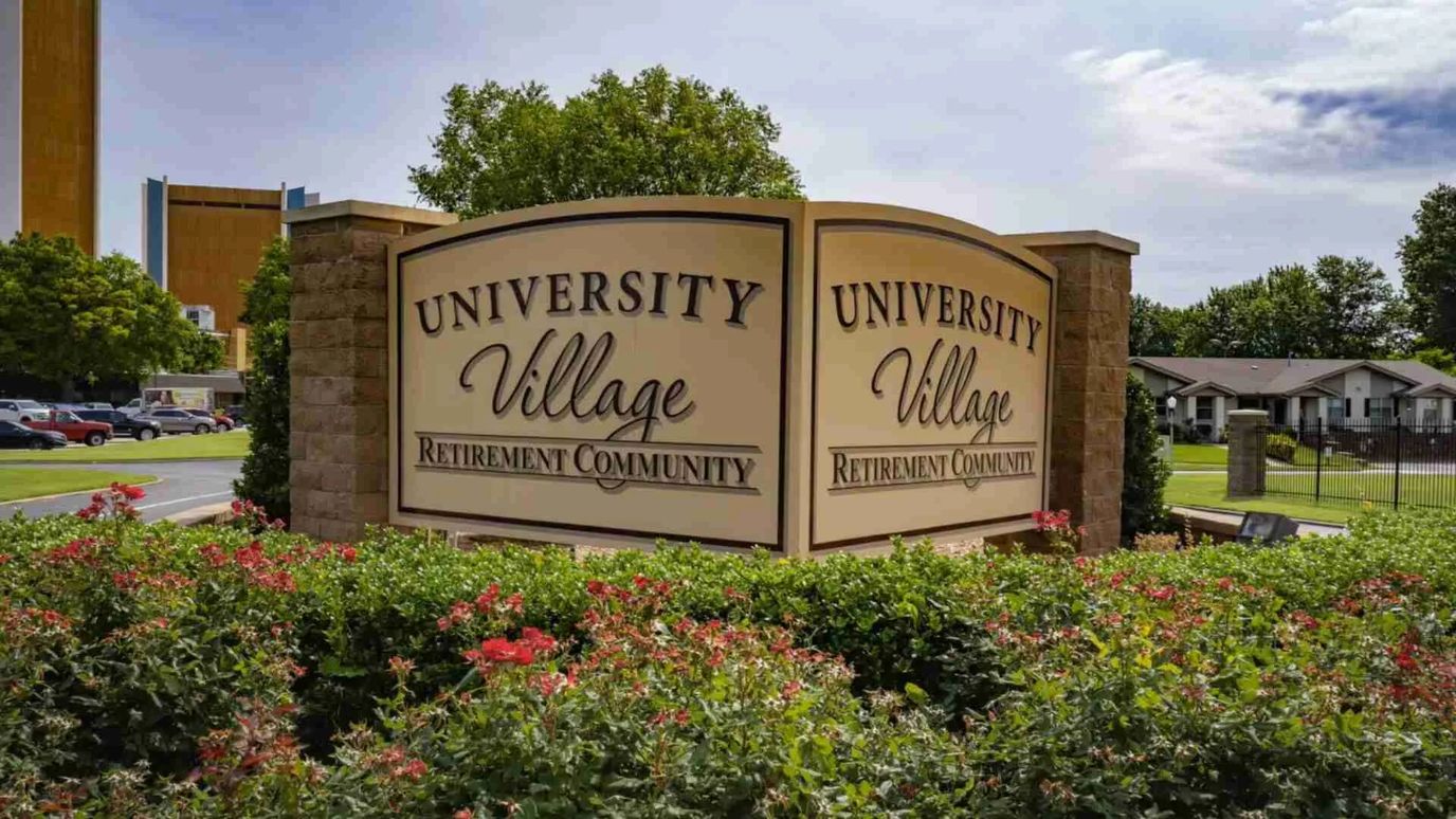 Entrance sign of University Village Retirement Community