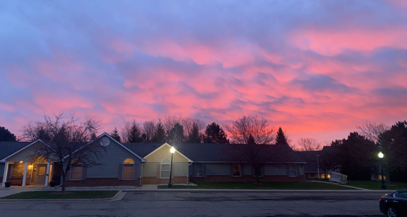 Building exterior with a vibrant sunset sky