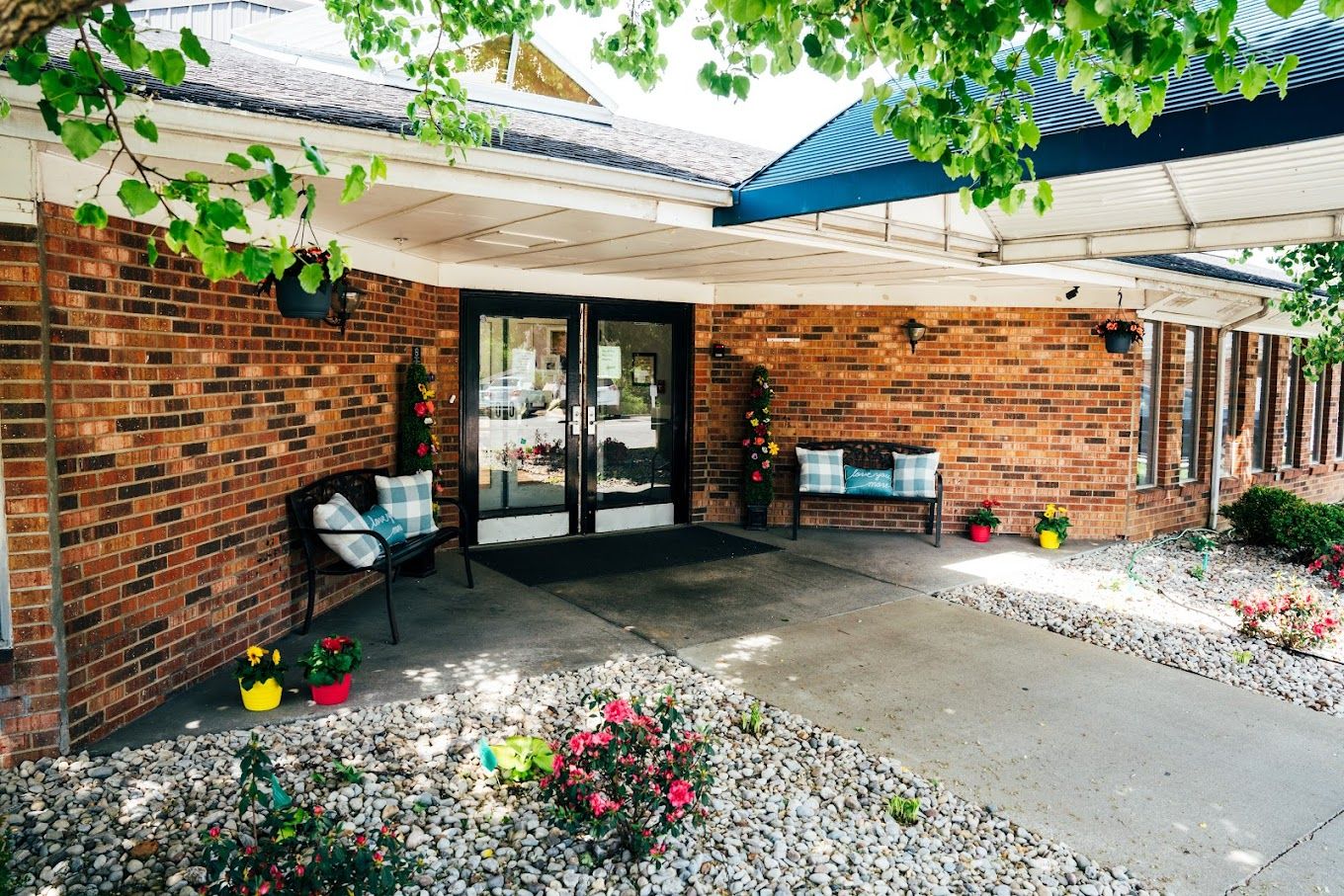 Entrance of Frankfort Care and Rehabilitation with colorful flowers