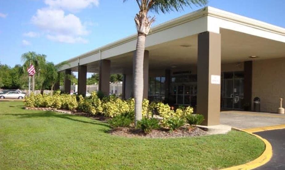 Entrance of Gandy Crossing Care Center with landscaping