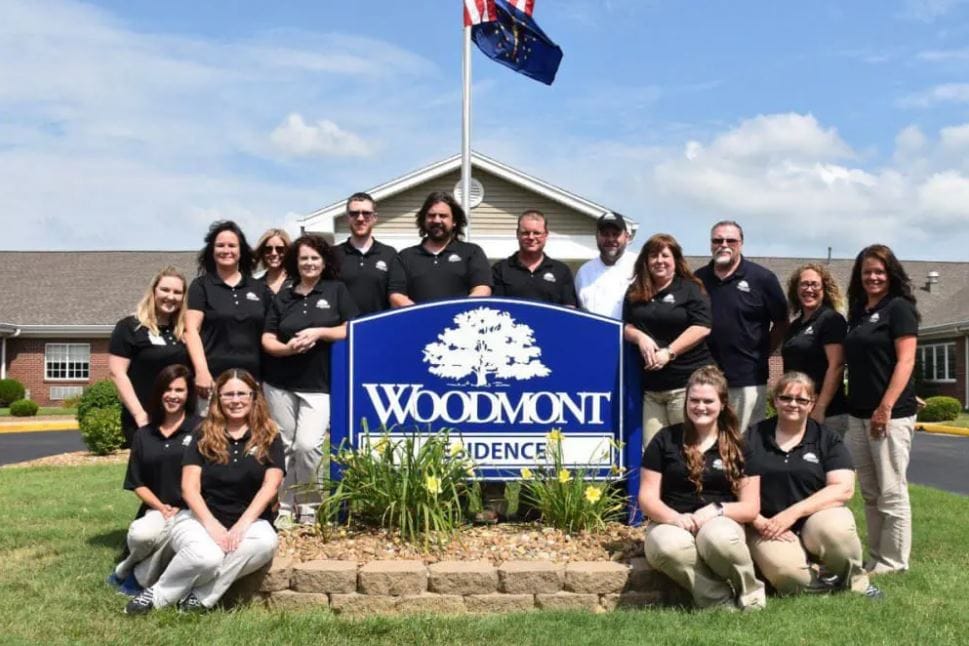 Staff group photo in front of Woodmont Health Campus