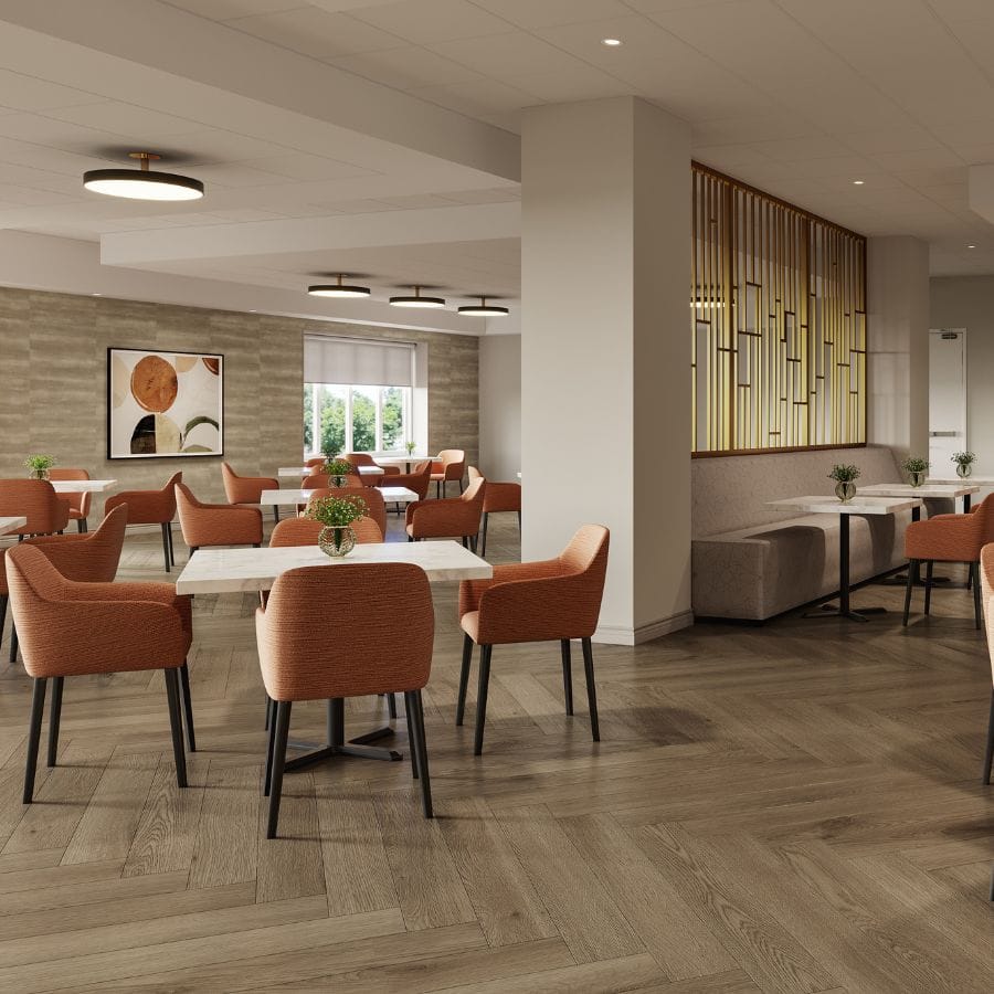 Bright dining room with orange chairs and tables