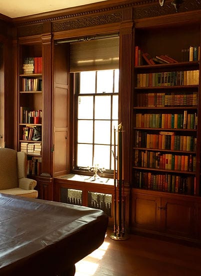 Warm interior of a cozy library with bookshelves