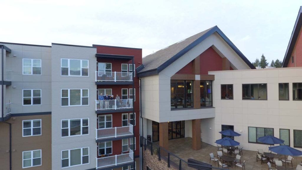 Aerial view of the facility building with outdoor seating areas
