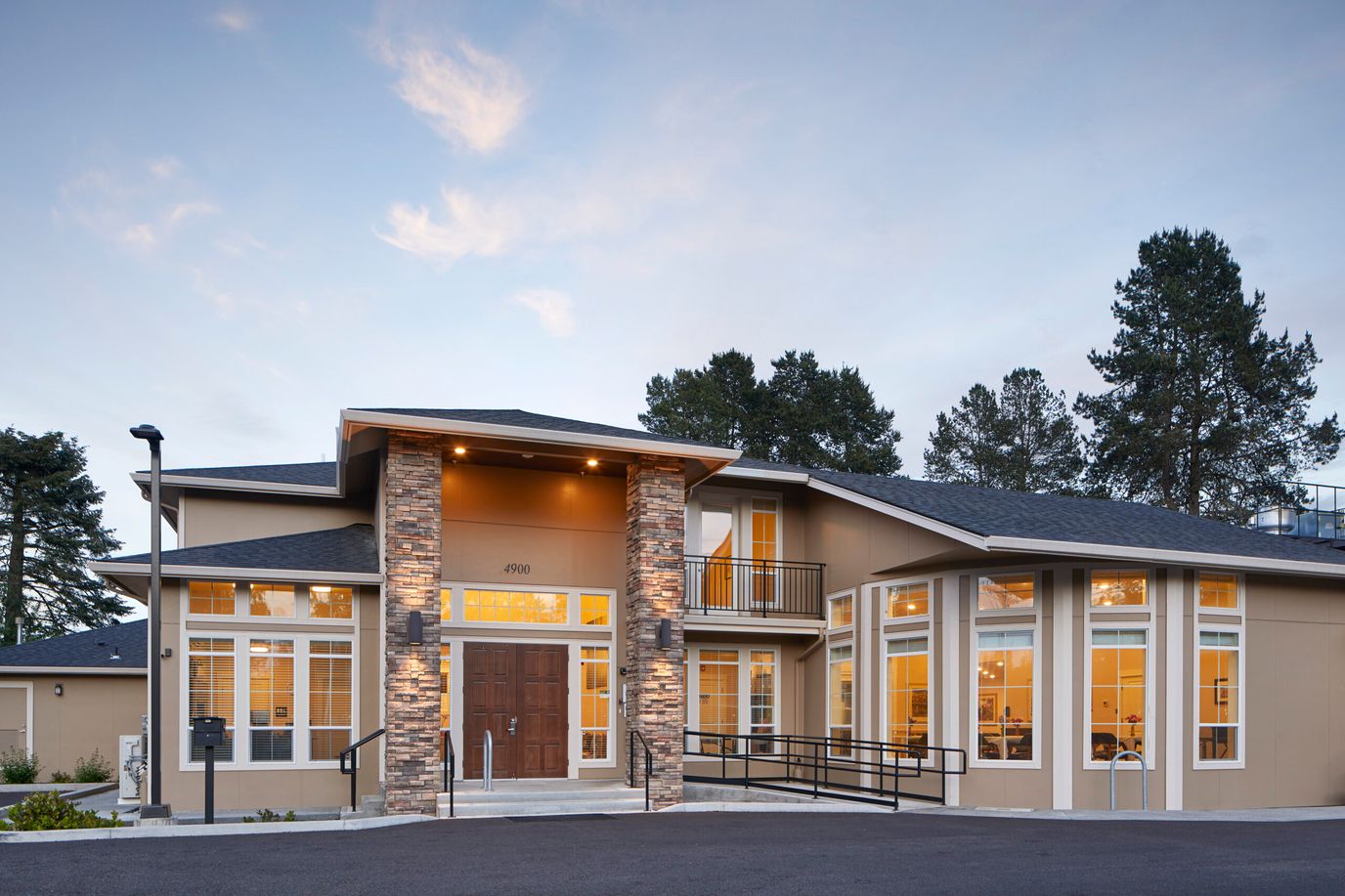 Exterior view of a memory care facility at dusk