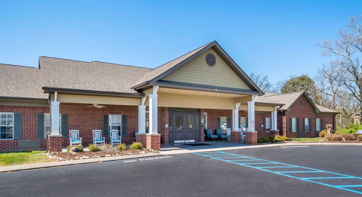 Entrance of an assisted living facility with rocking chairs