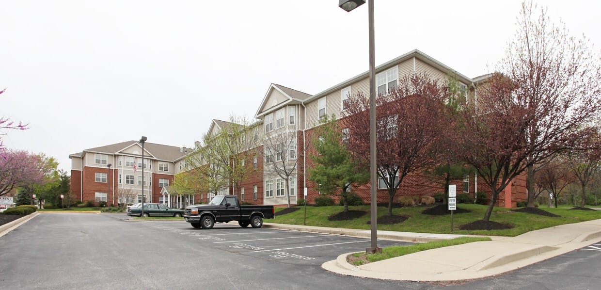 Exterior view of assisted living facility with parking