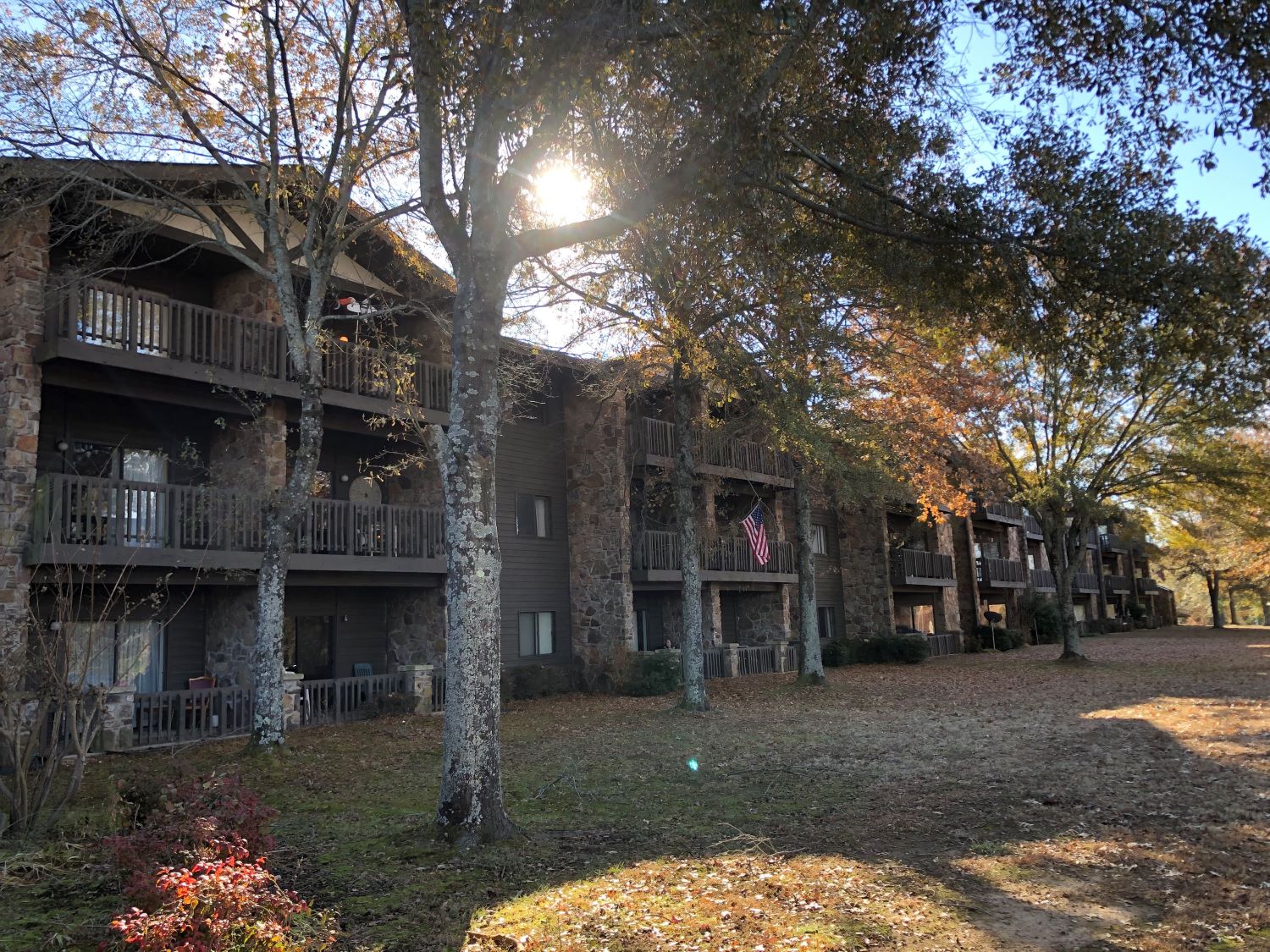 Exterior view of a senior living facility with trees