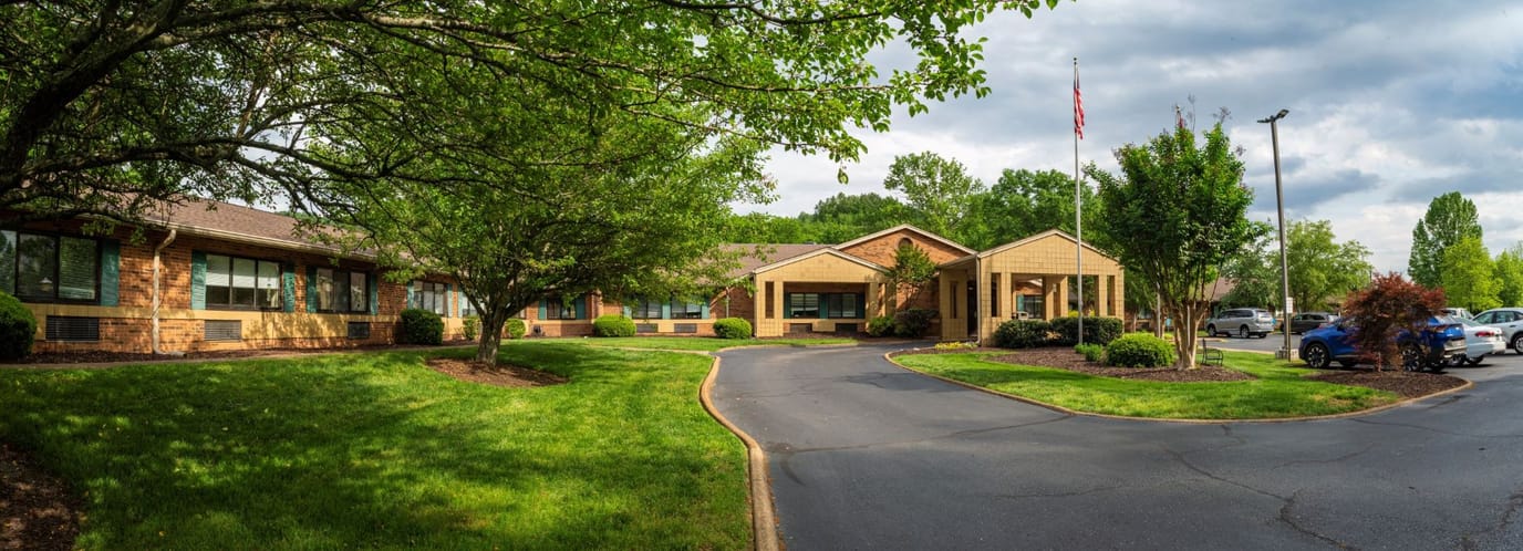 Exterior view of Life Care Center of Red Bank with landscaped grounds