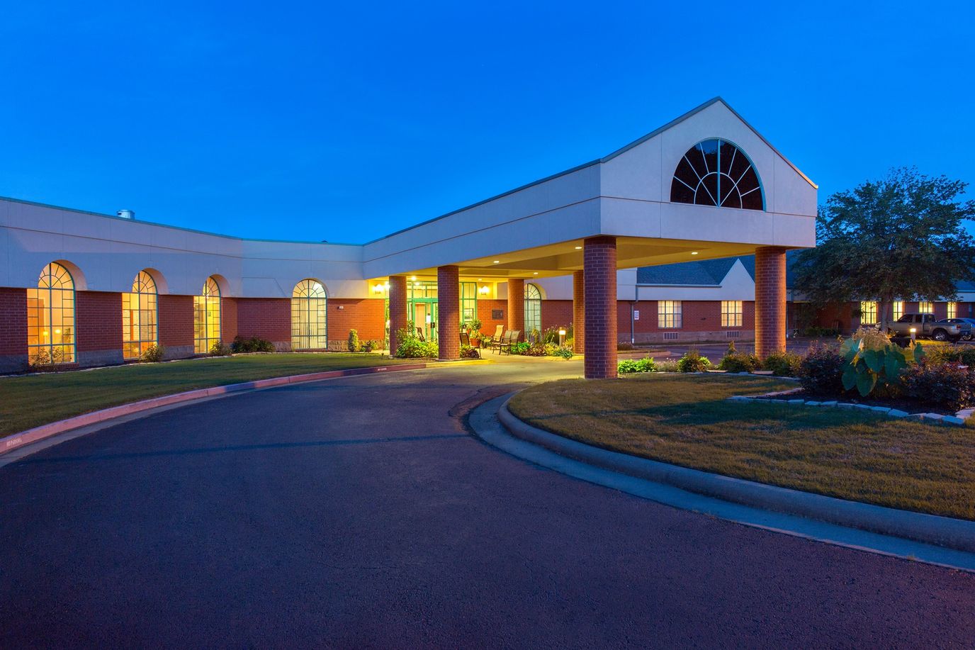 Exterior view of the facility entrance at twilight