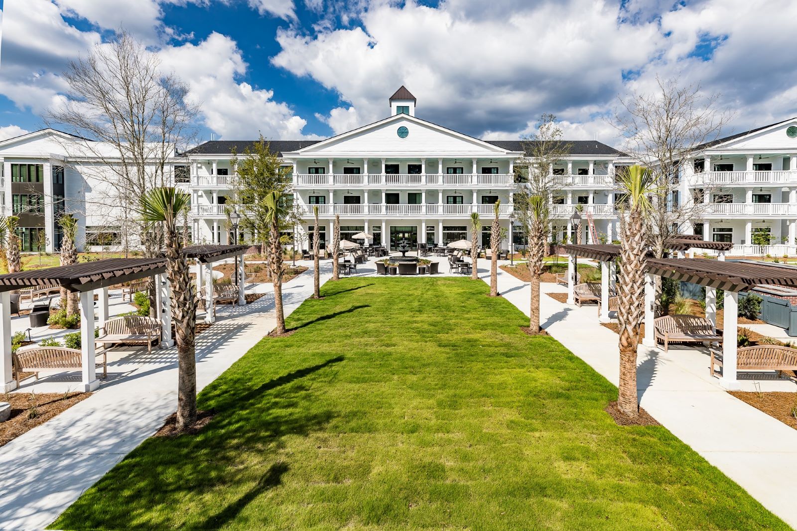 Exterior view of Merrill Gardens with landscaped grounds