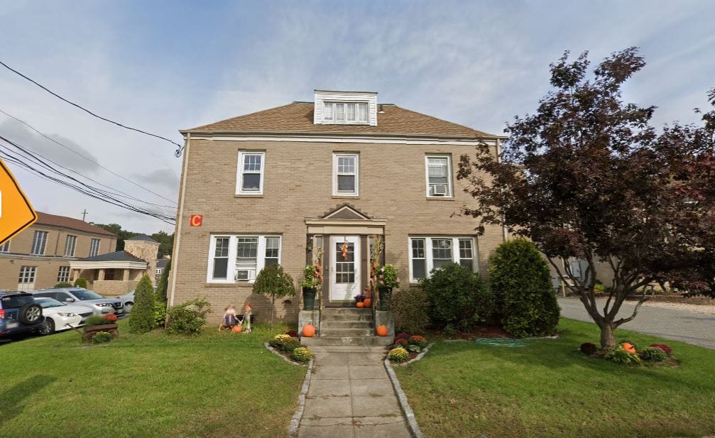 Exterior view of a building with fall decor