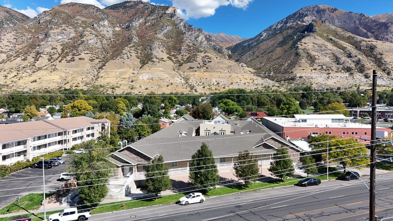 Aerial view of the assisted living facility surrounded by mountains.