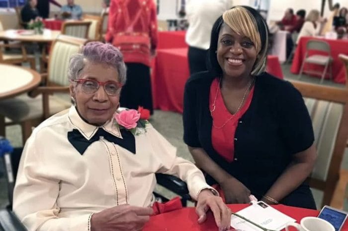 Magnolia Place of Roswell, assisted living in Roswell, GA — Senior resident and staff member at a celebration event