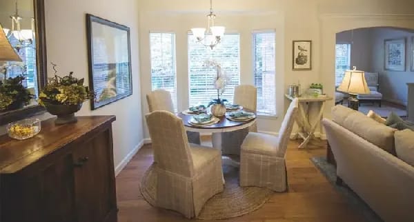 Brightly lit dining area with a round table