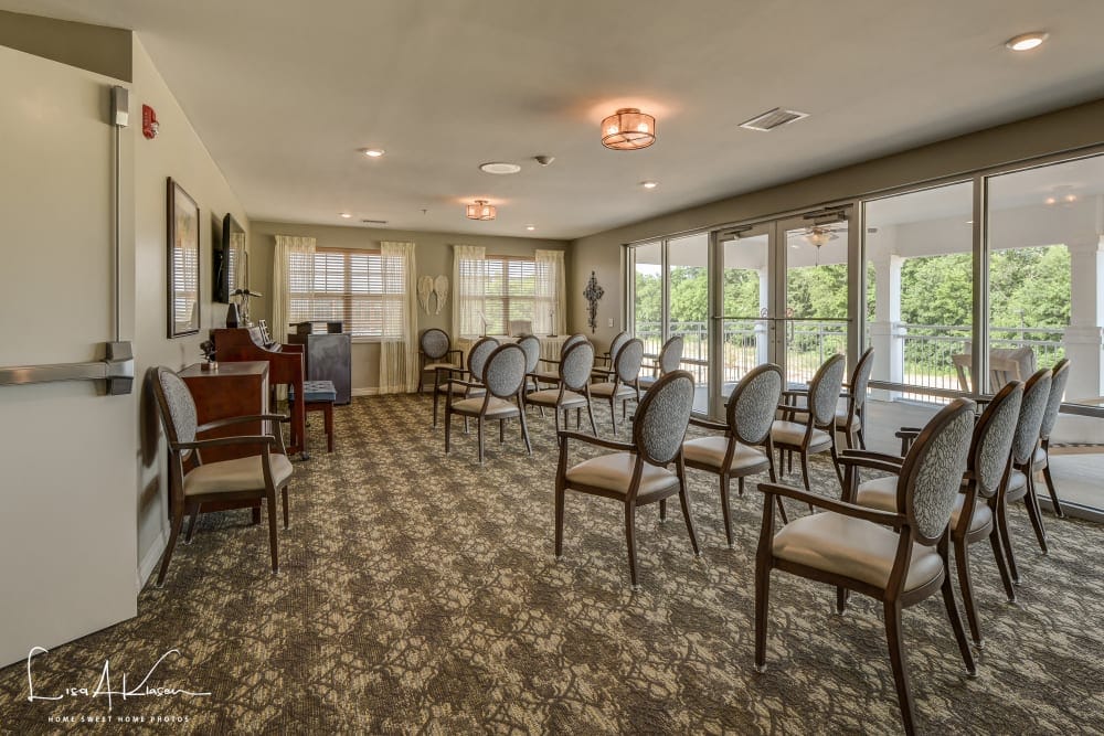 Bright activity room with chairs arranged for an event
