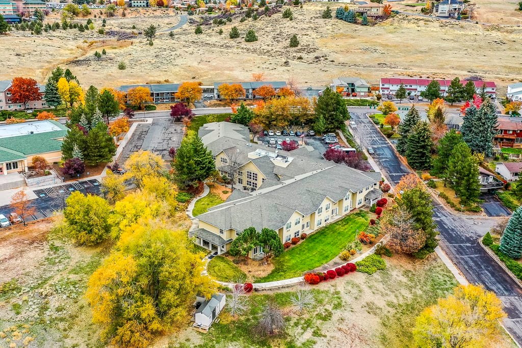 Aerial view of Klamath Falls Senior Living with colorful autumn trees