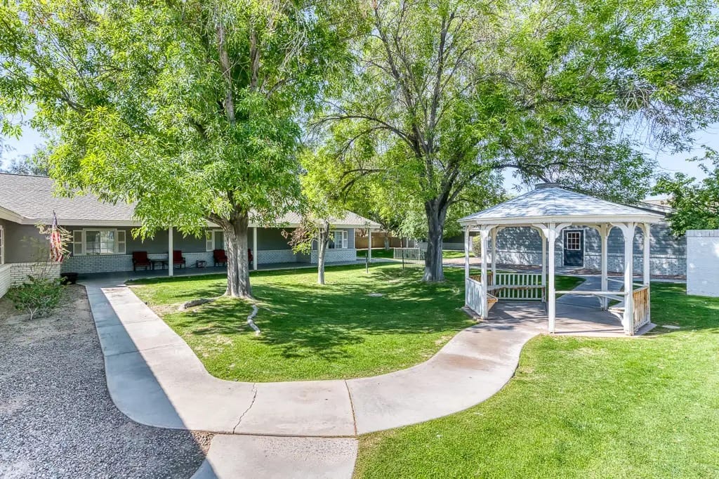 Lush outdoor space with trees and a gazebo