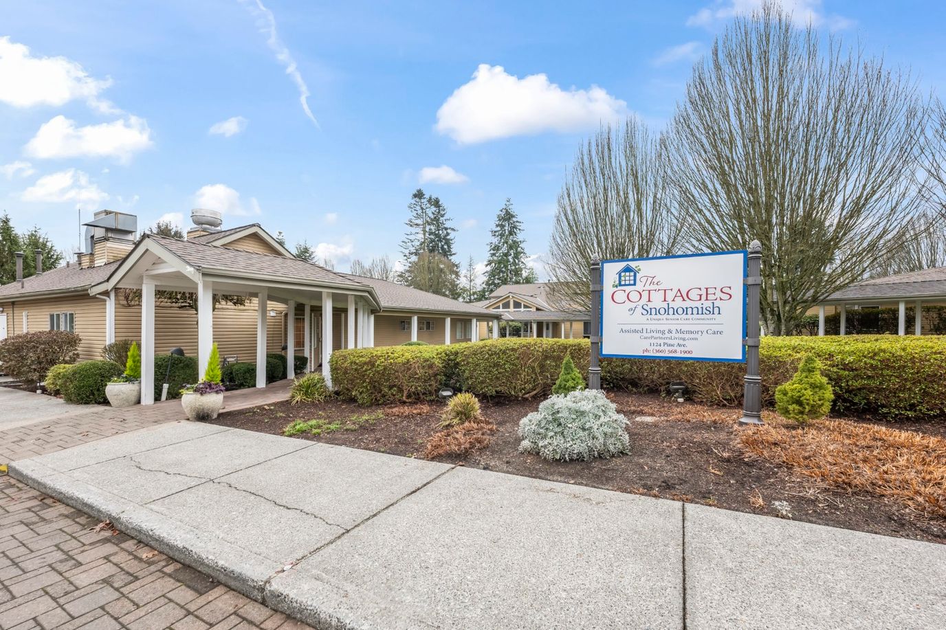 Exterior view of The Cottages of Snohomish with signage