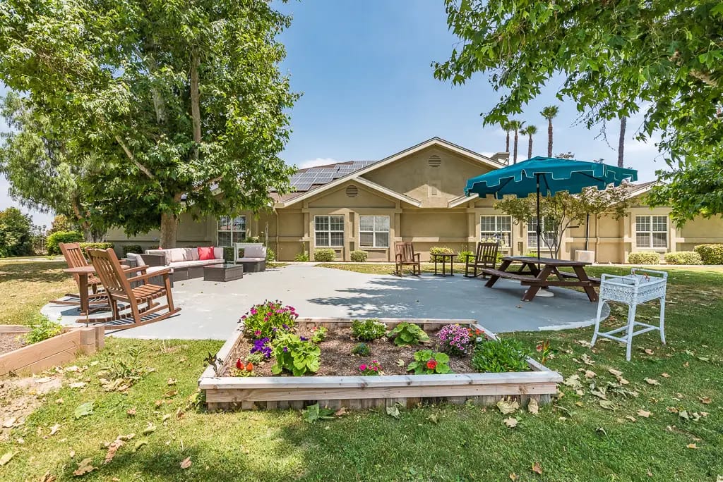 Outdoor patio area with seating and garden