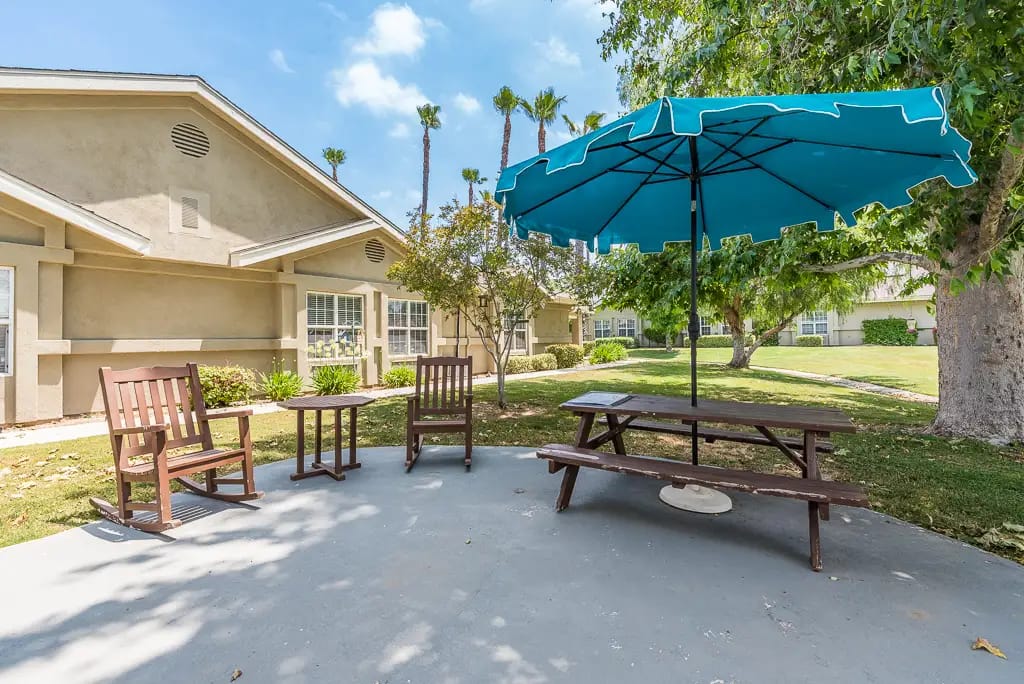 Outdoor seating area with umbrellas and chairs