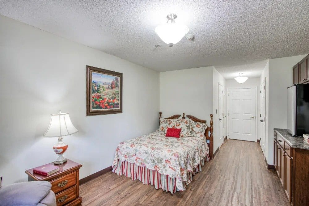 Cozy private resident room with floral bedding