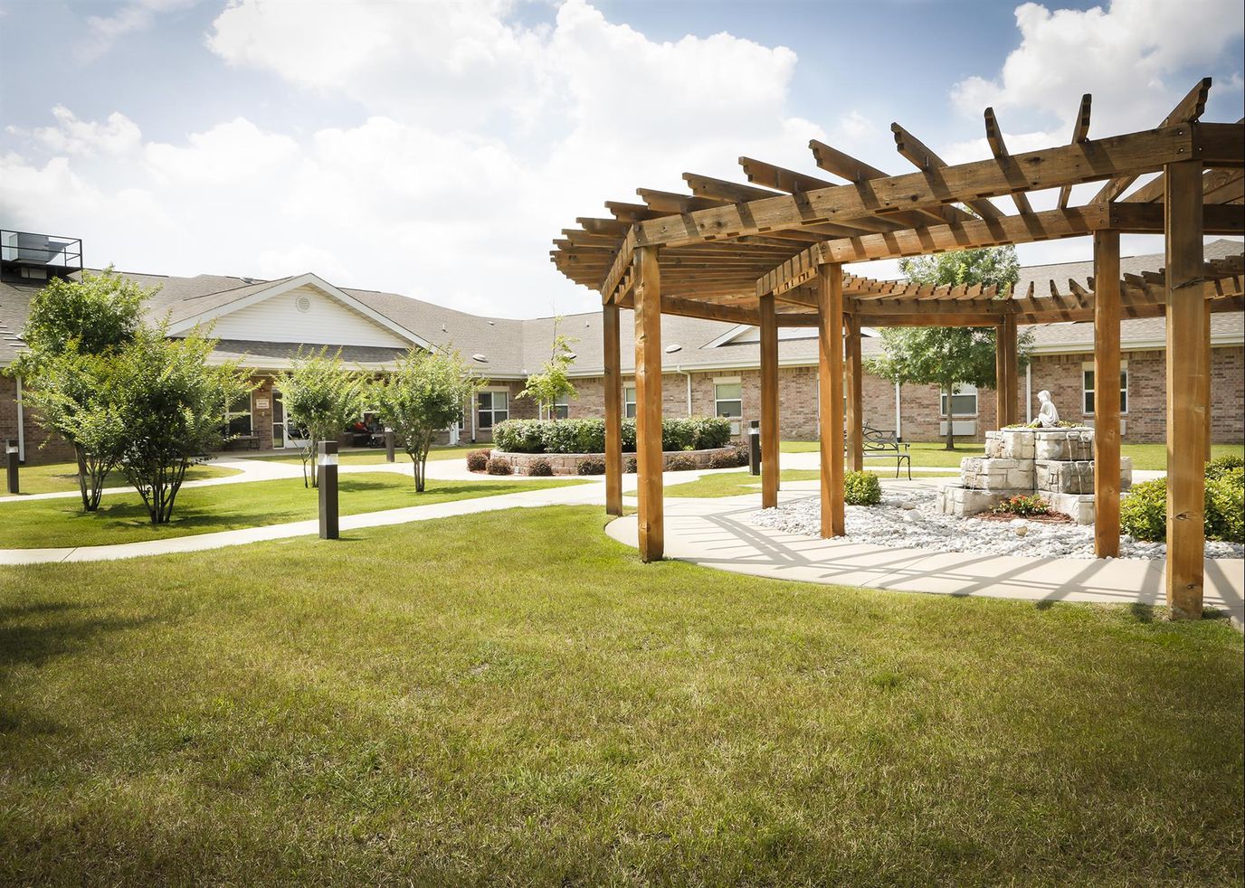 Outdoor garden space with pergola and landscaping