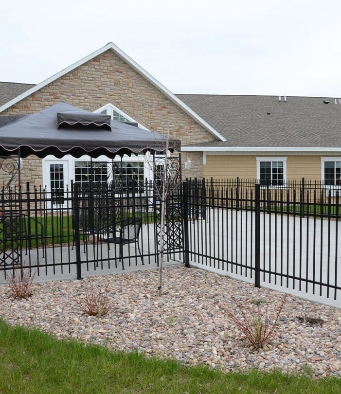 Outdoor space with a gazebo and fenced area