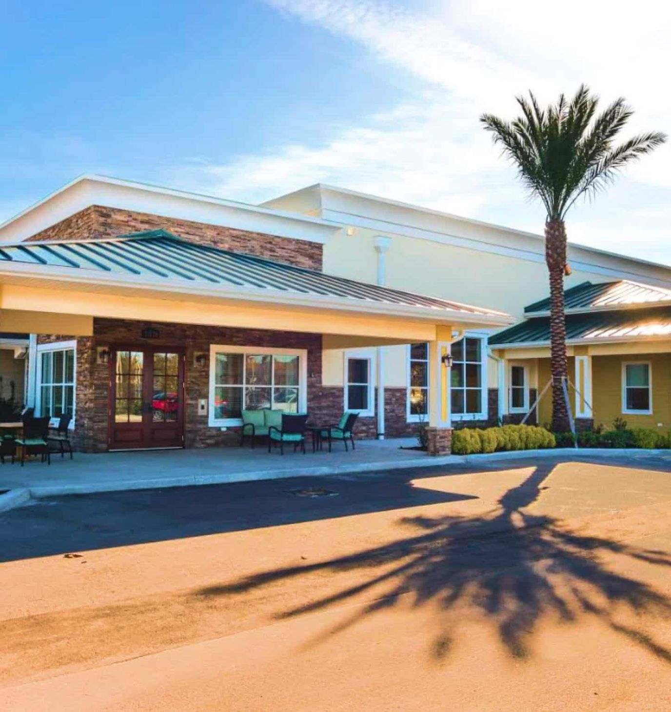 Exterior view of Certus at Waterford Lakes with palm trees