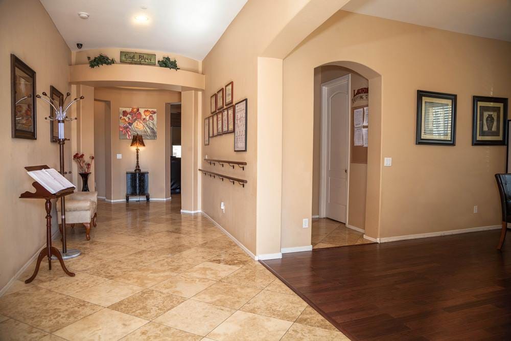 Bright hallway in a senior living facility with seating