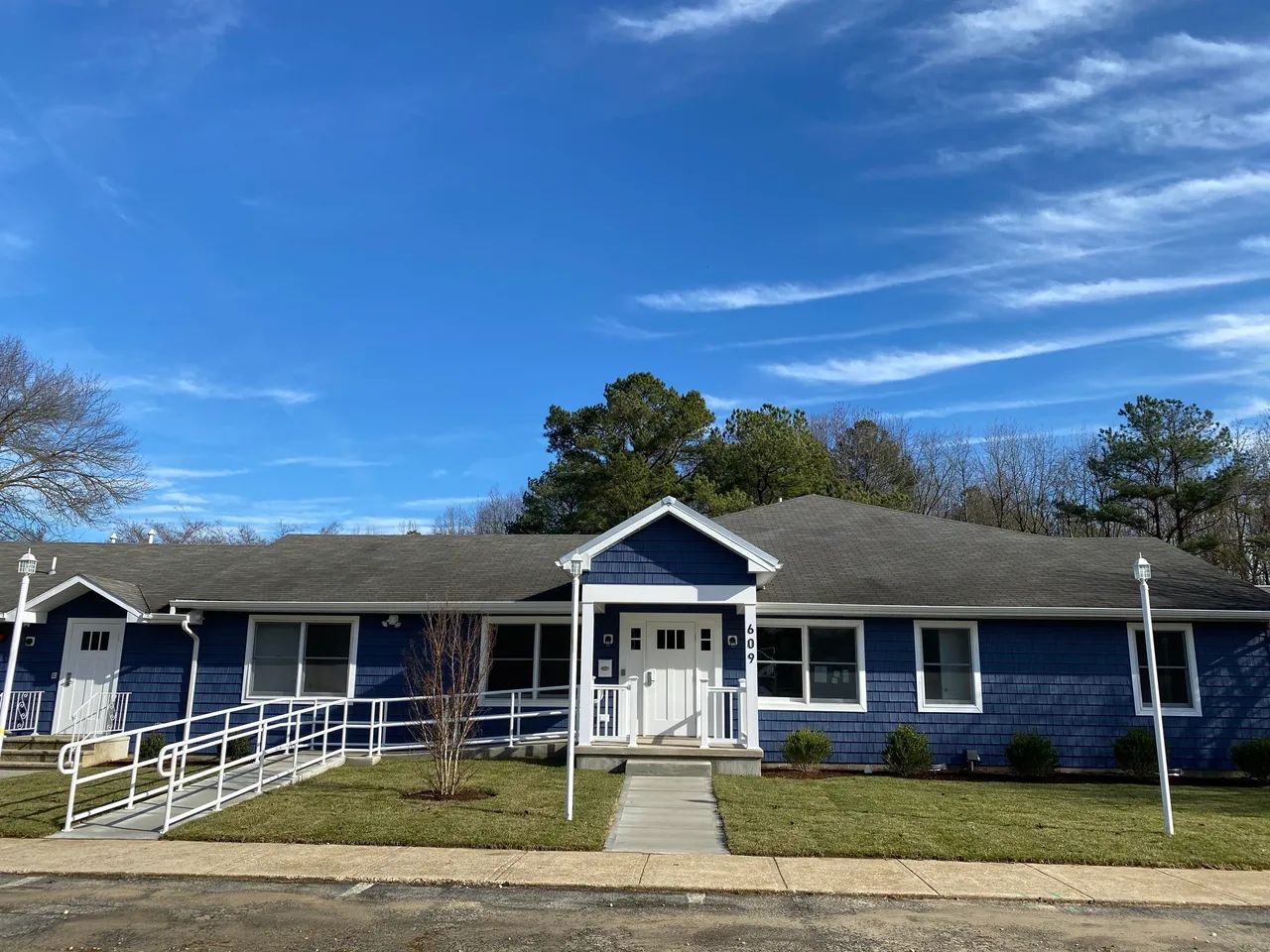 Exterior view of a blue assisted living facility