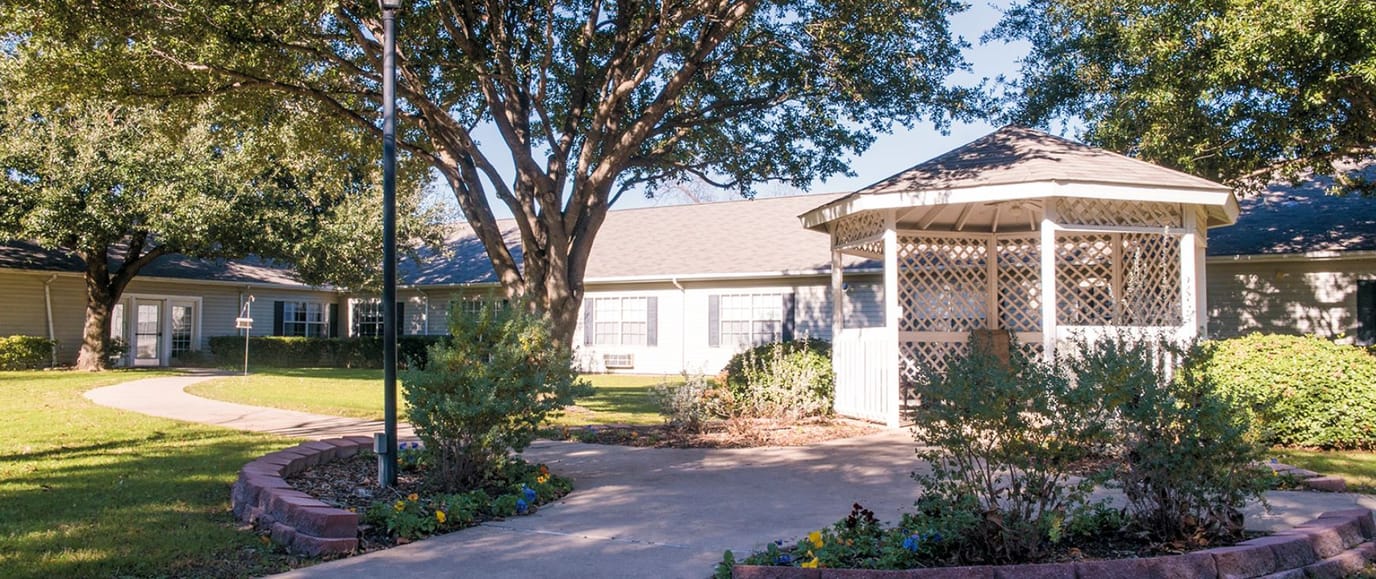 Outdoor garden area with gazebo and walking path