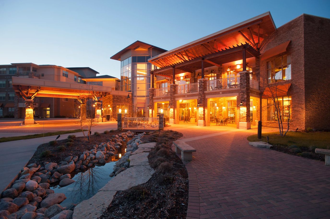 Exterior view of a senior living facility at dusk