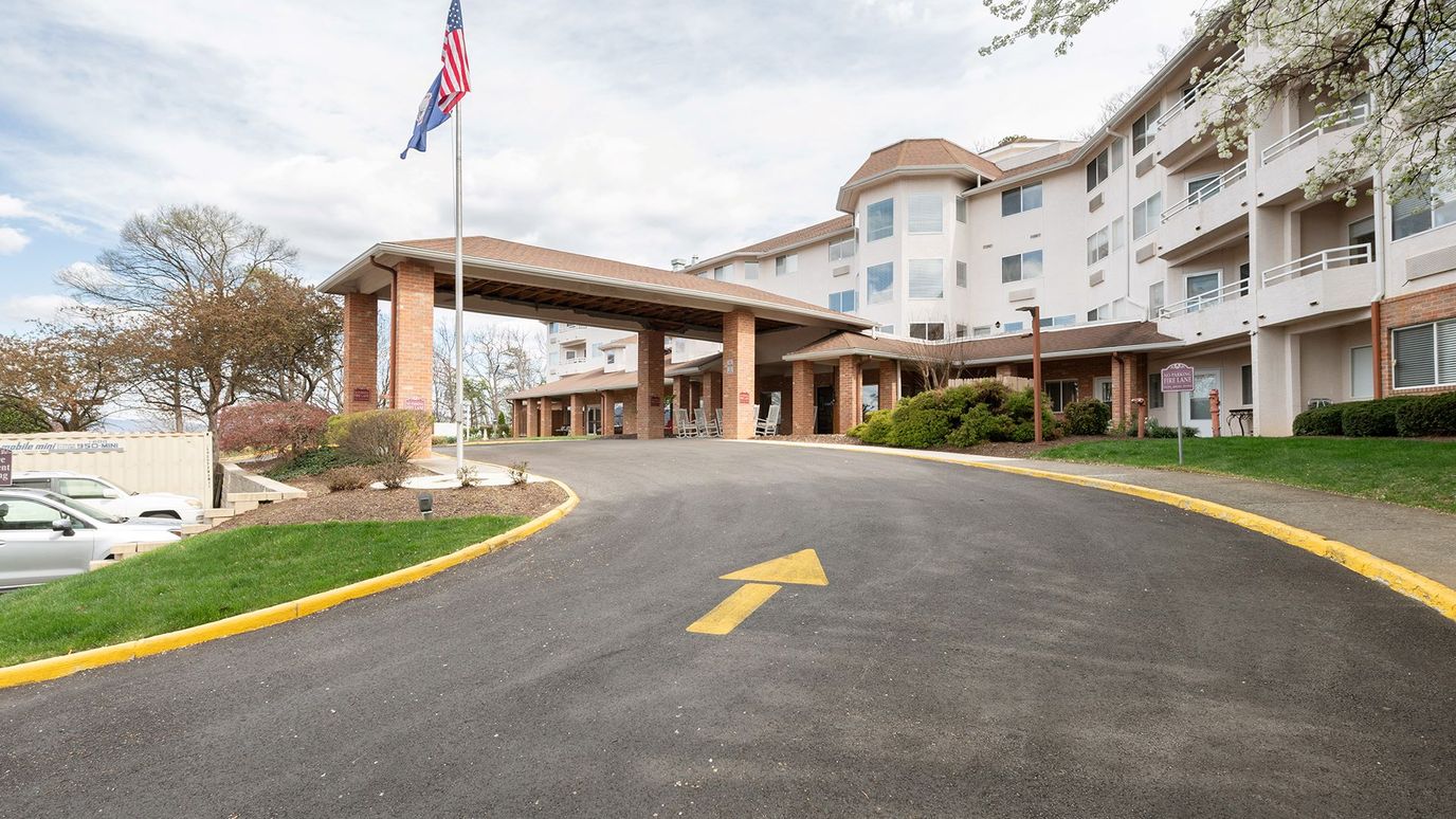 Entrance view of Holiday Elm Park Estates with landscaping