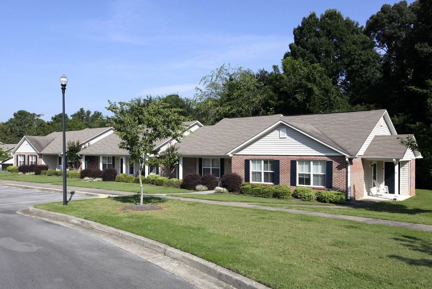 Exterior view of senior apartments with well-kept landscaping