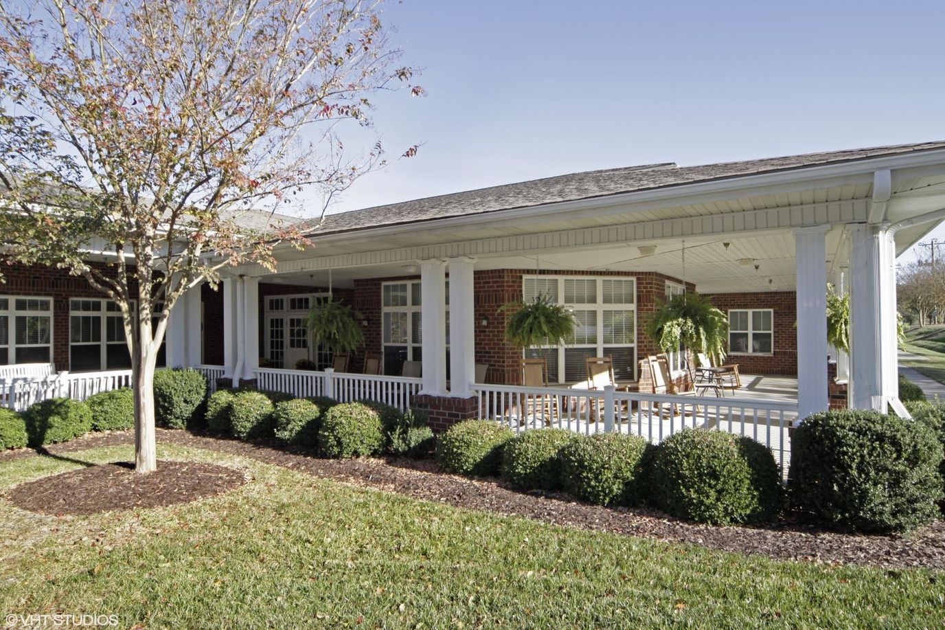 Exterior view of the facility with a porch and landscaping