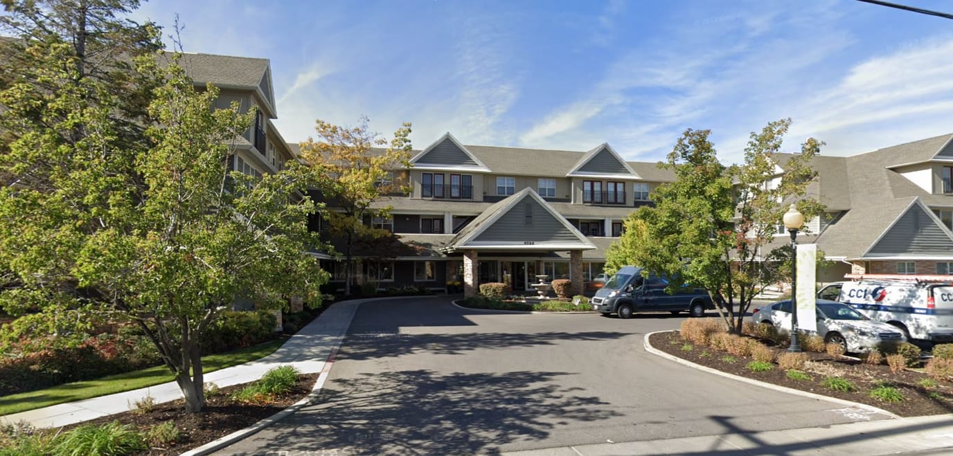 Exterior view of The Wellington with lush landscaping